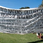 United Nations Declaration Banner drawing attention to indigenous rights.  Many aboriginals were denied the right to vote and those that did, were told get something or nothing because we will compulsorily acquire your land anyway.